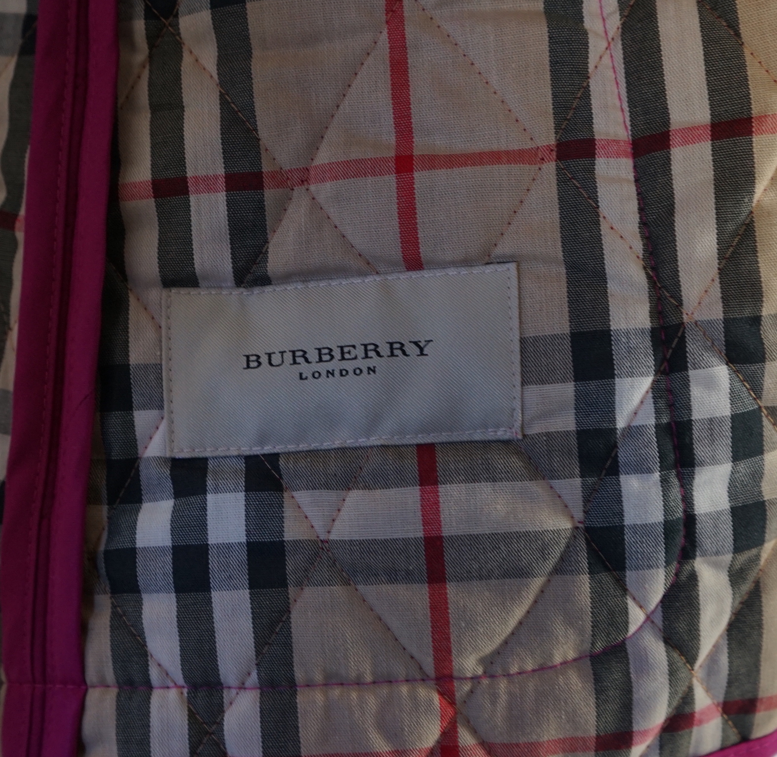 Two Burberry lady's quilted jackets, one pink and the other green, size Medium